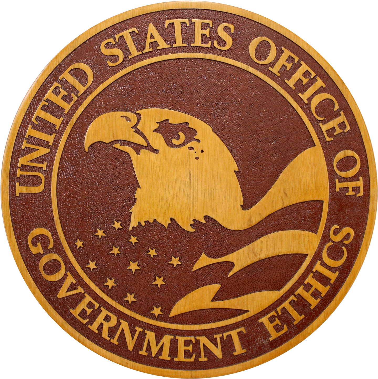 Office of Government Ethics seal plaque with a gold eagle and lettering against a reddish-brown field.