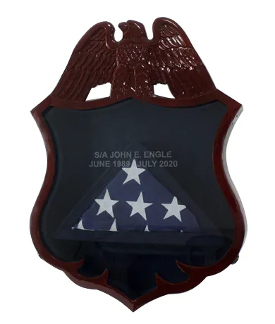 Military badge shaped military retirement shadowbox with flag