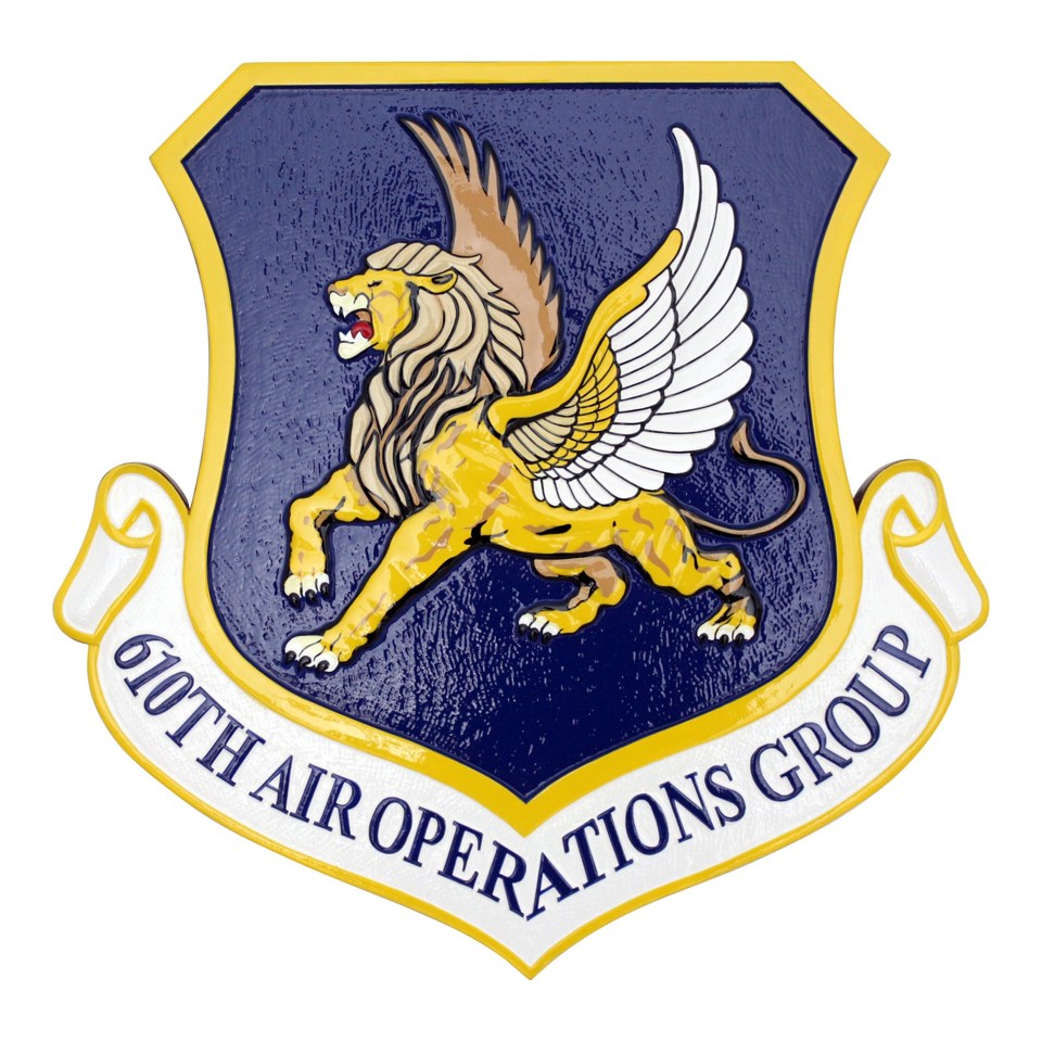 Shield-shaped 610th Air Operations Group plaque with a gold winged lion on a blue field.