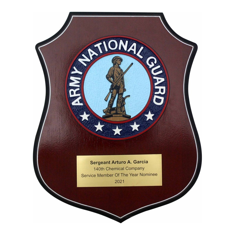 Army National Guard shield plaque with a Minuteman emblem and gold dedication plate.