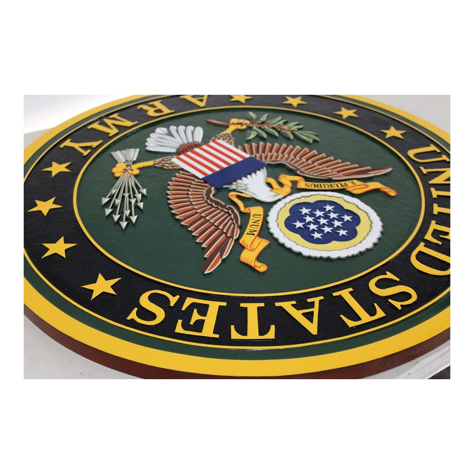 Angled view of a United States Army seal plaque showing the raised eagle and painted gold border.
