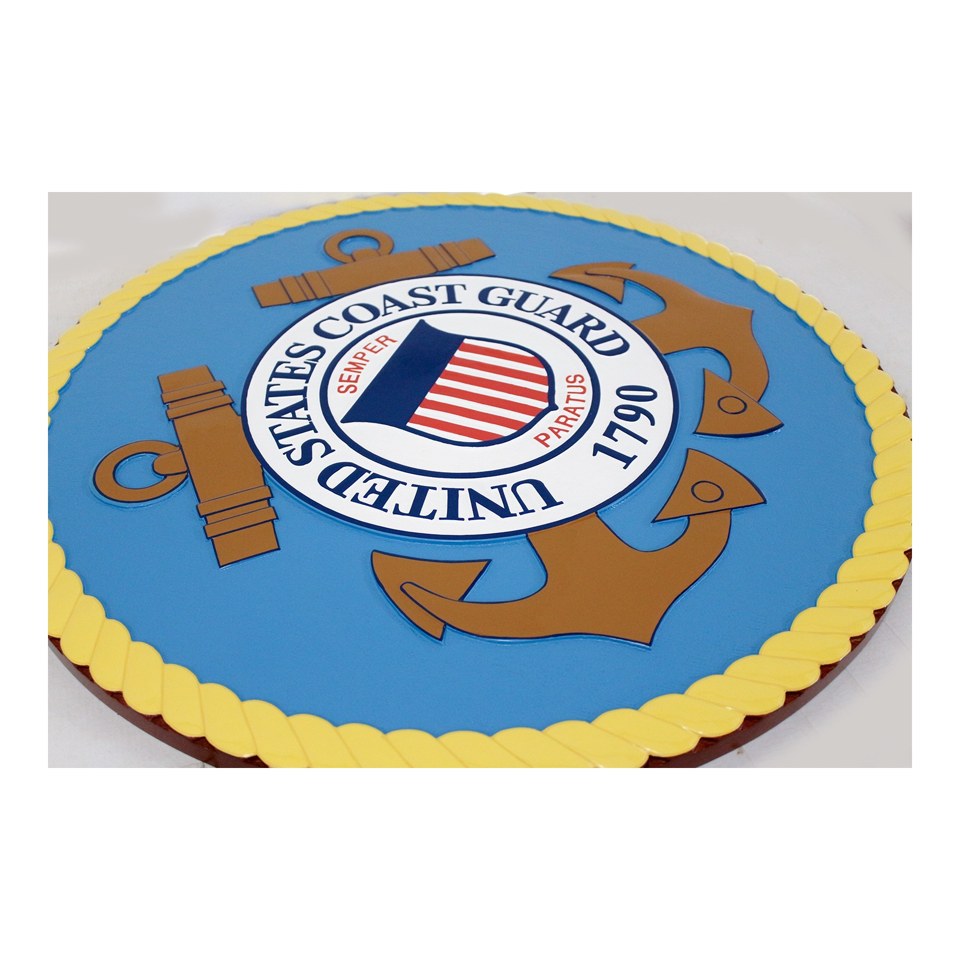 Angled view of a blue and gold United States Coast Guard seal plaque showing its raised border.