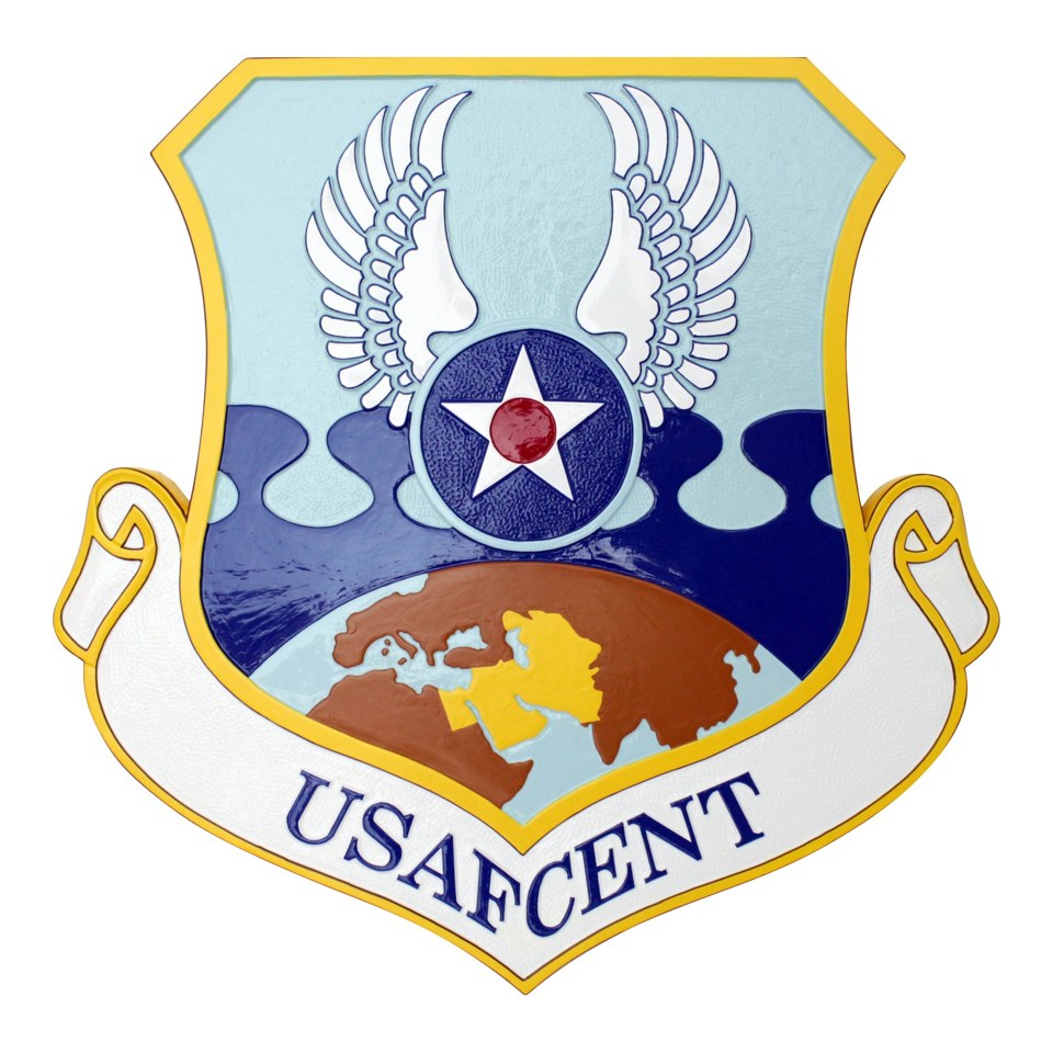 USAFCENT shield plaque with a white eagle, central star and globe on a blue field.